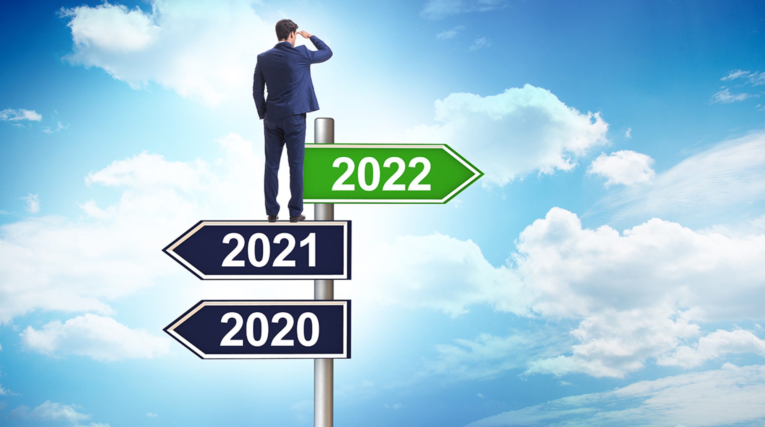 Businessman on signpost from 2021 to 2022